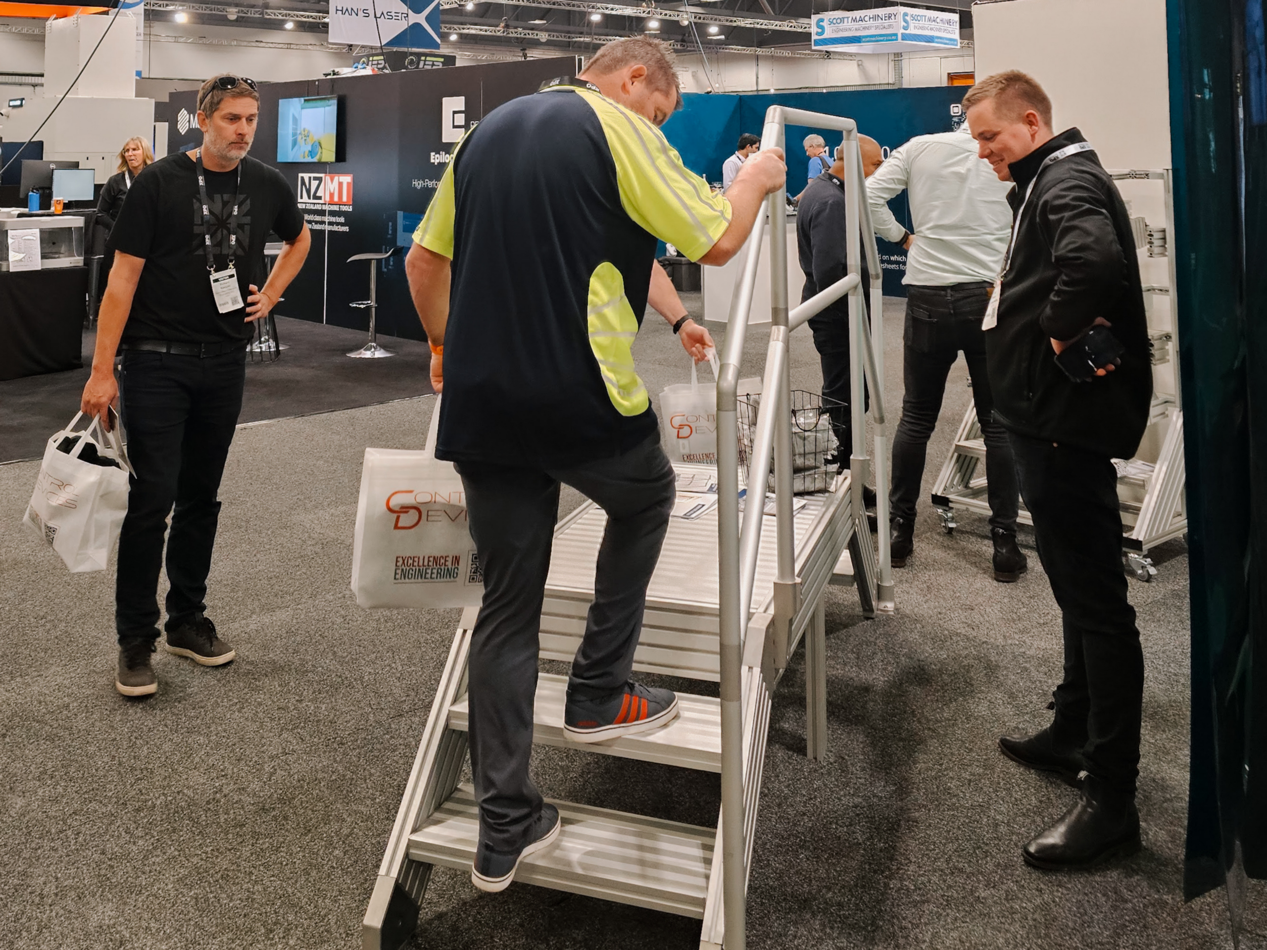 Visitor testing the SlotPro T-Slot aluminium Stair and Platform System at EMEX 2026.
